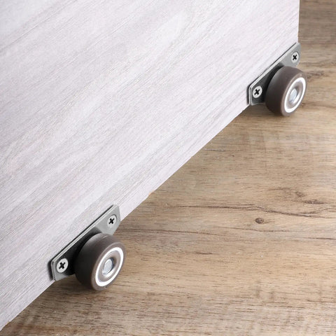 Mini Side Mount Casters 1.25 Inch With Mounting Screws For Furniture installed on wooden surface
