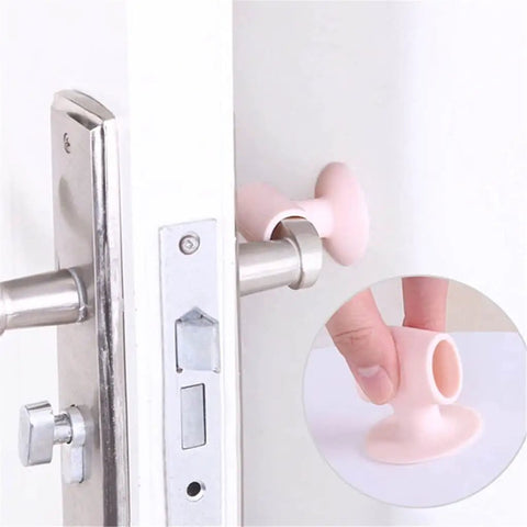Soft silicone anti collision door pads with suction cup attachment protect walls and cabinets; pink pad on door handle