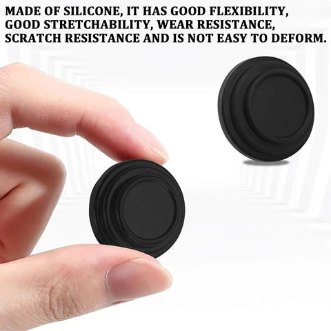 Hand holding silicone door shock absorber pad, with another pad in view; durable, wear-resistant, self-adhesive for cars.