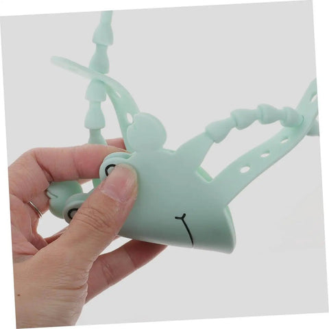 Hand holding 2 Pack Door Slam Preventer Covers Noise Reduction Silencers For Quiet Safe Closures Easy To Install On Doors
