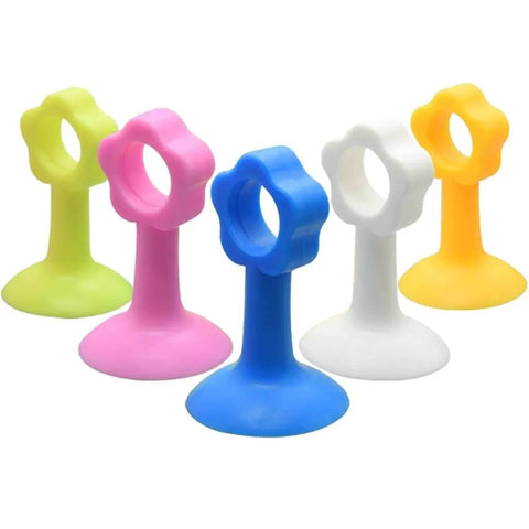 Colorful silicone door stopper bumper pads and wall protectors with suction cups for soft closing doors and cabinets.