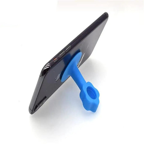 Silicone Door Stopper Bumper Pad And Wall Protector For Soft Closing Doors And Cabinets Reduces Noise And Impact Protects Walls Provides Gentle Cushioning And Easy Mounting With Suction Cup For Tile Surfaces And Handy Phone Holder shown supporting a phone.
