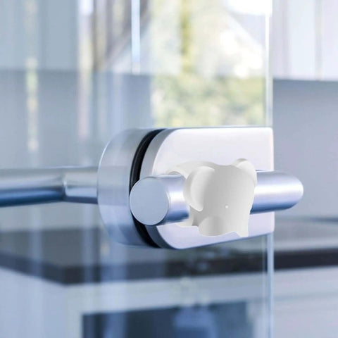 Soft silicone door wall protector cushions every swing to prevent scuffs, reduces door noise, installed on a glass door
