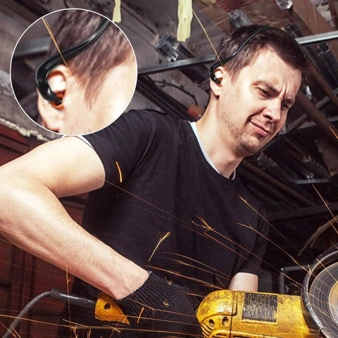 Man using power tool wearing Orange Banded Silicone Ear Plugs for Shooting Range and Noise Reduction with Lightweight Plastic Banding