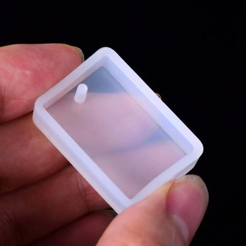 Close-up of a rectangular silicone mold from Resin Molds Silicone Pendant Mold Kit With 15 Shapes for DIY jewelry making projects.