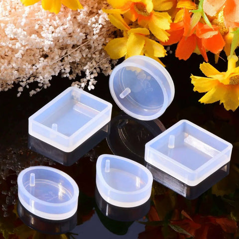 Resin Molds Silicone Pendant Mold Kit With 15 Shapes For DIY Jewelry Making, featuring round and square molds, on a reflective surface