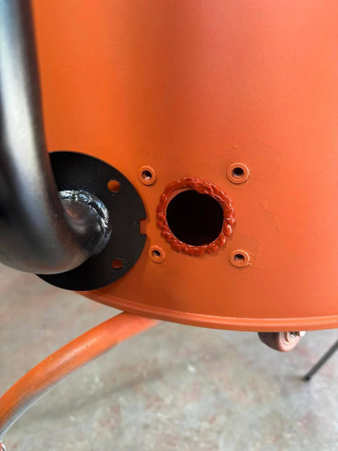 Close-up showing High Temp Silicone Adhesive Sealant For Grills And Smokers sealing a hole on a BBQ or smoker surface