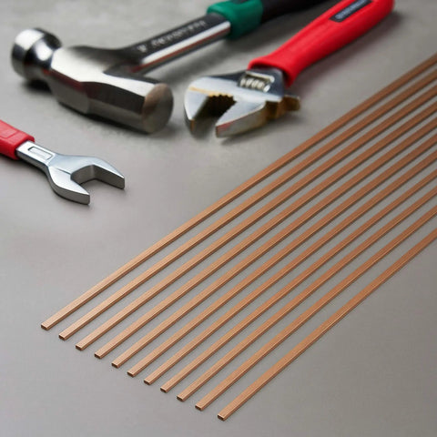 BCuP-5 15% Silver Brazing Rods, 0.050 x 1/8 x 10 Inches arranged with hand tools for HVAC welding