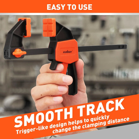 Hand holding Six Inch Mini Bar Clamps 2 Pack For Woodworking And Home Projects, Quick Release F Clamp With 75 Lbs Clamping Power