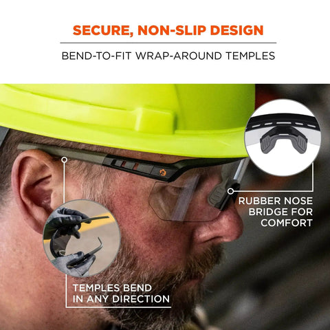 Man wearing Skullerz Aegir Safety Glasses with oversized blade style and UV protection, featuring bendable rubber nose bridge and temples.