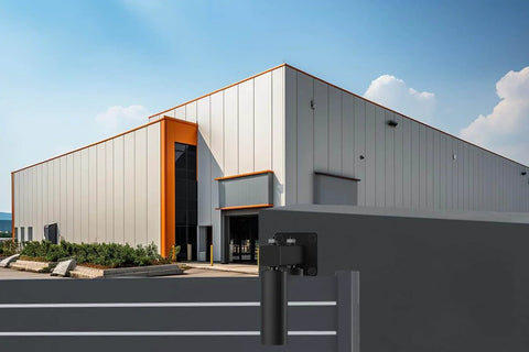 Installed Adjustable Sliding Gate Guide Roller 6 Inch Dual Hard Nylon Rollers on heavy duty steel gate, adjacent to modern building.
