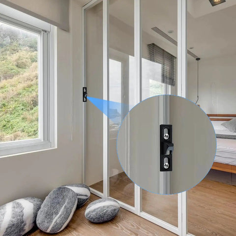 Two Pack Sliding Door Keepers For Sliding Glass Doors Lock Latch Replacement With Mounting Screws Included Black Finish Designed With Vertical Screw Slots For Easy Adjustment And Friction Bumps On The Back To Prevent Sliding Ideal For Patio Door installed on a glass door in bedroom