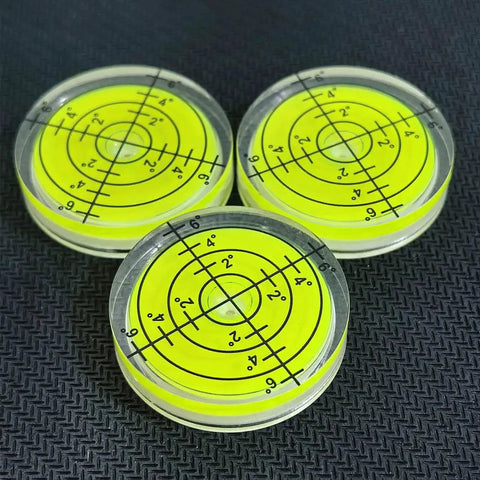 Three Pack Small Circular Bubble Levels 32x7mm Acrylic Round Spirit Level For Layout Tools on black surface