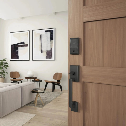 Smart WiFi Front Door Deadbolt With Built In WiFi App Control And Keyless Entry Unlock From Anywhere Through The Connected App Apple Watch Unlock Capability With HomeKit And Alexa Compatible Matte Black Finish Easy Install For Enhanced Security And installed on wooden door in living room view