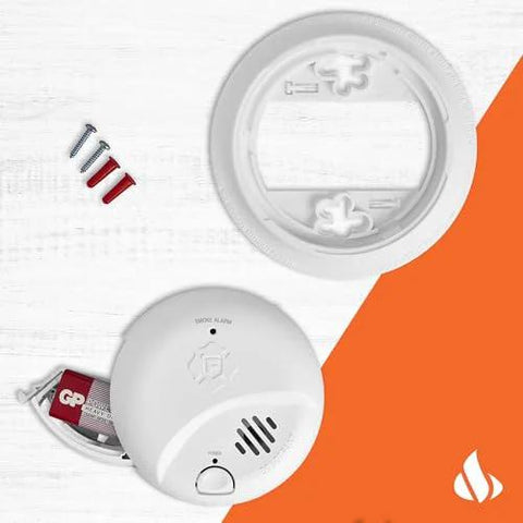 SMI100 Battery Operated Smoke Alarm With Test And Silence Button showing components and battery compartment on orange background.