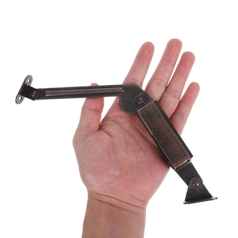 Hand holding 2pcs Soft Close Lid Support Hinges Spring Friction Fold Down Swing Down Hinges for Wooden Boxes Cabinets