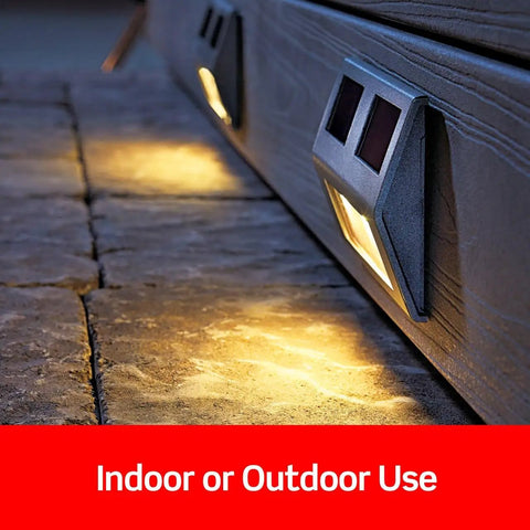 Outdoor lighting fixtures on a stone surface with solar panels, suitable for indoor or outdoor use.