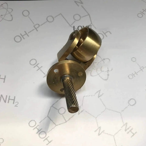 Solid Brass Caster Set With 25mm Wheels, 360 Degree Swivel, Screw Mount Fittings, Vintage Polished Brass Finish on background.