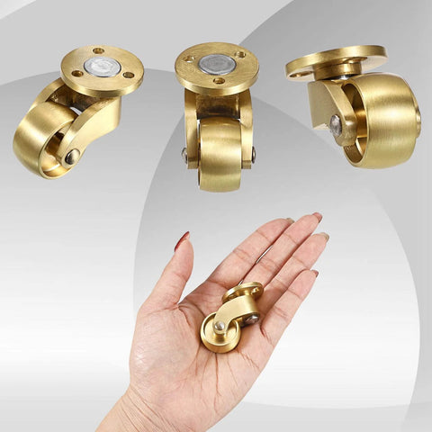 Hand holding 4PCS Universal Brass Stem Casters 1 Inch Furniture Caster Wheels, showcasing heavy-duty swivel design and solid metal construction.