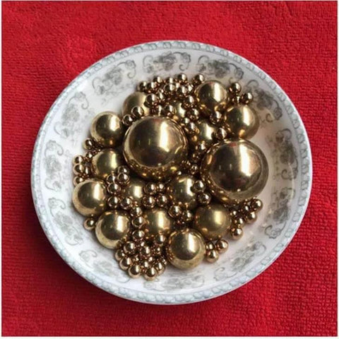 Bowl filled with 4mm 200pcs Solid Pure Copper Balls - Brass Ball Bead on a red background.