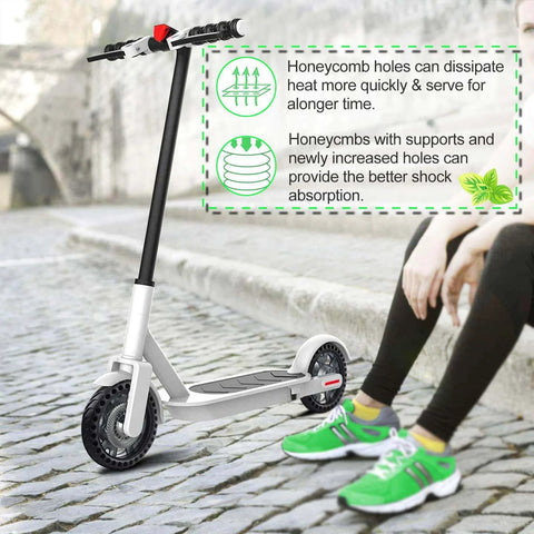 Electric scooter on cobblestone path with 50/75-6.1 Tubeless Solid Tires for Electric Scooter, 8 1/2 x2 Tire features displayed.