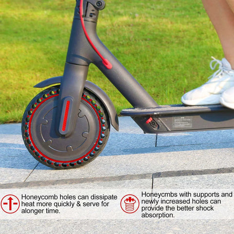 Close-up of 8.5x2 solid tire on electric scooter, showing honeycomb holes for shock absorption, suitable for Gotrax GXL V2/XR/APEX.