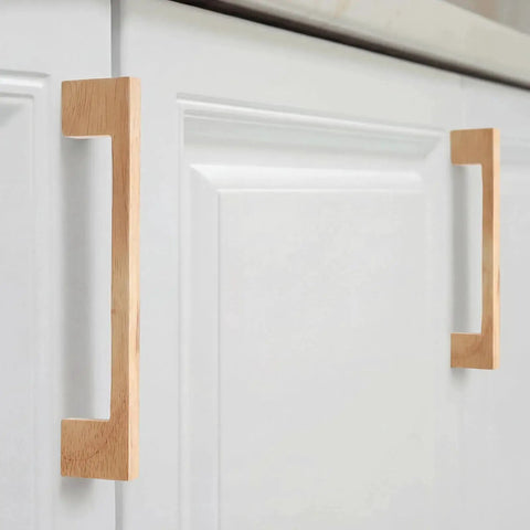 30 Pcs Solid Wood Cabinet Pulls Set for Kitchen Cabinets and Furniture 5.51 Inch Length with 128 Mm Hole Spacing installed on white cabinets