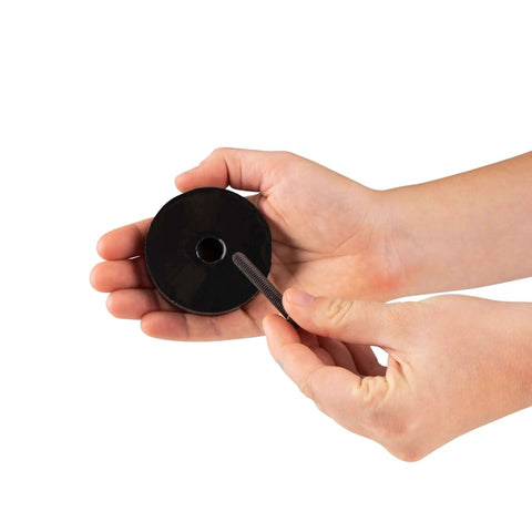 Hands holding Anti Vibration Leveling Mount Kit With Sorbothane Shock Absorption 70 Duro For Superior Dampening One Quarter Twenty Mounting Stud