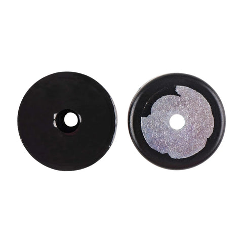 Top view of two Sorbothane mounts, 2 inch diameter, 70 Duro, showing center holes and surface details.