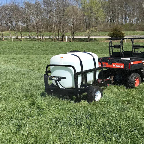 Everflo 12V On-Demand Diaphragm Sprayer Pump - 5.5GPM, 60 PSI, Quick Attach Ports mounted on a utility vehicle in a field