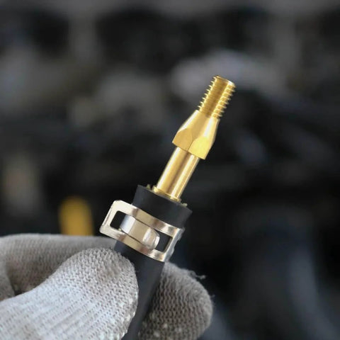 Close-up of a spring band type hose clamp with 12mm inner diameter on a hose, highlighting zinc plated steel and brass fitting.