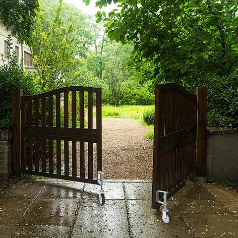 2 Pack Spring Loaded Gate Casters For Wooden And Metal Gates, 4 Inch Heavy Duty Gate Wheels With 360 Degree Swivel installed on gate.