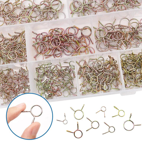 Close-up view of 330Pcs Nine Size Spring Hose Clamps Set 5mm To 13mm in a plastic organizer, showing 65Mn galvanized spring clips.