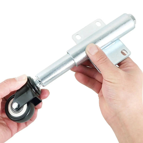 Close-up of hands holding Spring Loaded Gate Caster Set Of Two With Two And A Half Inch PU Swivel Wheels Four Hole Mounting Plate