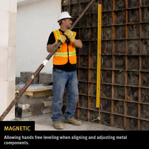 Worker using Stabila Type 96M 24 Inch Magnetic Level with rare earth magnets for precise plumb on metal construction site