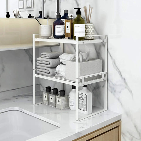 Two Pack Steel Frame Stackable Cabinet Shelf Organizer Racks in bathroom with towels and toiletries, white finish.
