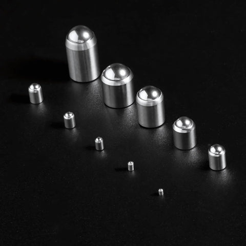 Assorted sizes of 5mm x 6mm ball plungers spring loaded detent screws made of stainless steel displayed on a black background