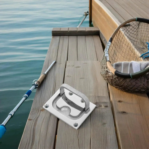 Front view of stainless steel boat flush hatch handle with base plate and screws on wooden dock