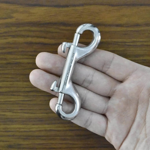 Hand holding 3.5 Inch Double Ended Bolt Snap Hook, Stainless Steel Marine Grade 316, for Diving and Boating Use