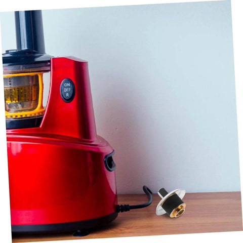 Replacement Coupling Pin for Juicer and Blender Parts With Stainless Steel Construction next to a red juicer base on a counter