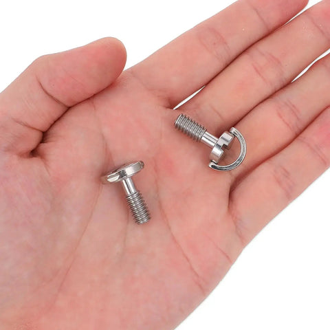 Hand holding two stainless steel camera screws, Two Pack One Quarter Twenty Thread D Ring Stainless Steel Camera Fixing Screws For Tripod Mounts and Quick Release Plates