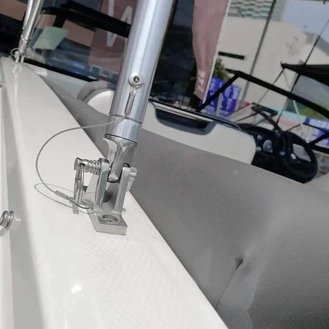 Installed stainless steel quick-release boat deck hatch hinge pin on white boat deck