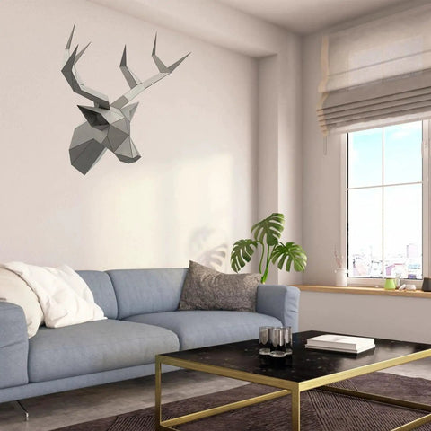 Deer head made from Beginner Welding Practice Kit With 201 Stainless Steel Coupons 15 Pieces hangs on a living room wall above a sofa.
