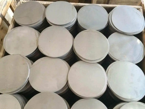 Stack of two inch diameter quarter inch thick 304 stainless steel round disc plates USA made with precision CNC plasma cut for clean edges.
