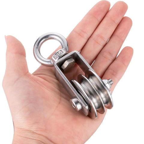 Person holding SHINICO Double Cable Pulley Block Heavy Duty Stainless Steel, Bearing Inside, Swivel Single Pulley Wheel, Good for Pulley Lifing System, Loading 550lb, 1 Pack