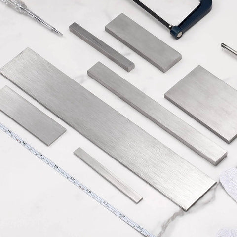 Stainless Steel Flat Bar Quarter Inch Thick By Two Inch Wide Twelve Inch Long With Heavy Duty Brushed Finish Trim Strip For Kitchen Diy Crafts 304 Grade Silver Tone uxcell displayed with tools.