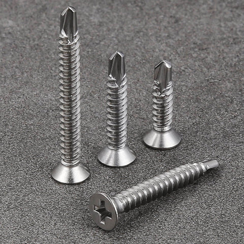 500pcs #8 x 5/8 Inch Flat Head Self Tapping Sheet Metal Screws in stainless steel with deep threads, displayed on gray surface