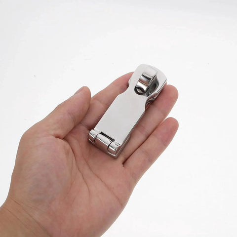 Front view of marine-grade stainless steel gate latch with swivel padlock eye, 75x25mm, held in hand