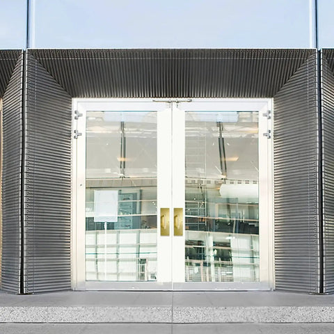 12 Inch Stainless Steel Door Handle Pull And Push Plate Set Heavy Duty Gold Brushed Finish installed on glass doors in public building