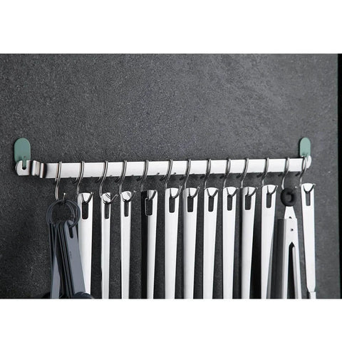 Kitchen Utensil Rail Organizer - Wall Mounted Gourmet Rack with 14 Hooks showing hanging utensils against a dark wall